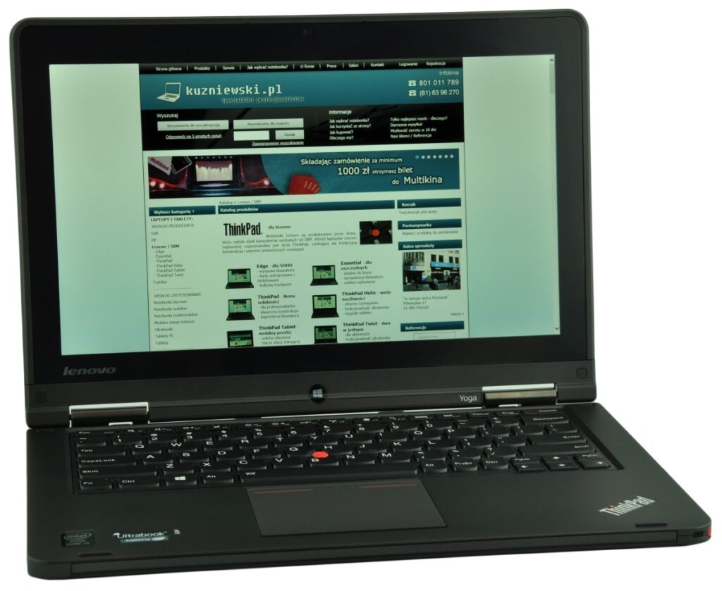 Black Lenovo ThinkPad laptop open, displaying a website on the screen.