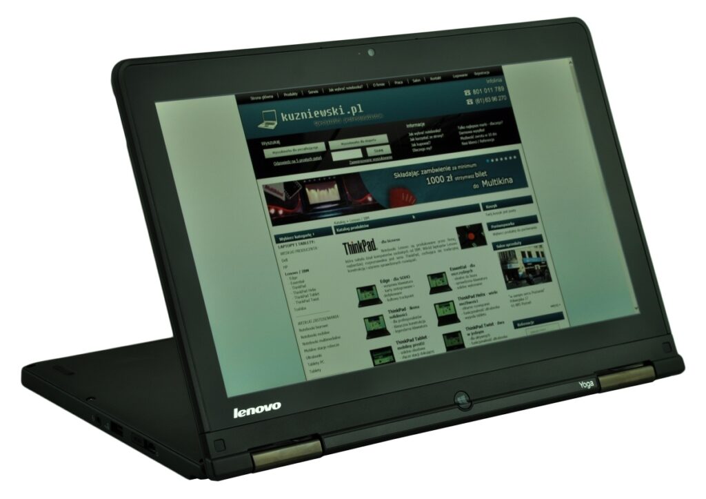 Lenovo ThinkPad Yoga laptop in tent mode displaying a Polish website on the screen, logo visible on the base