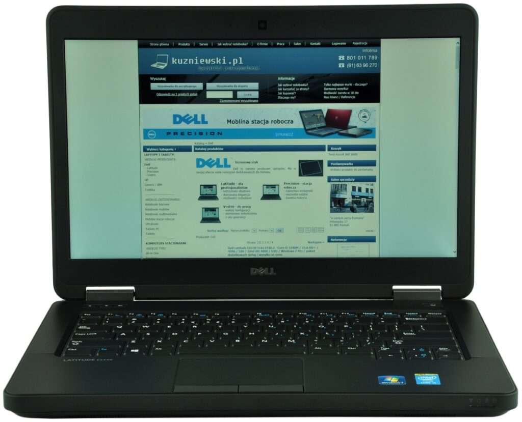 dell-latitude-e5440-5194_125283 - lab-kuzniewski.pl - Testy laptopów, recenzje i porównania Dell laptop open, screen displaying a Polish tech website with blue banners; keyboard visible in the foreground.