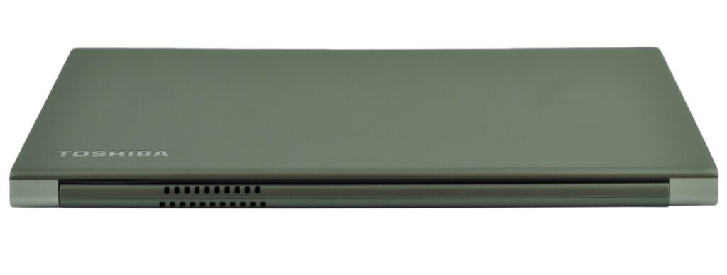 Closed gray Toshiba laptop viewed from the side, showing cooling vents along the base edge and a slim profile.