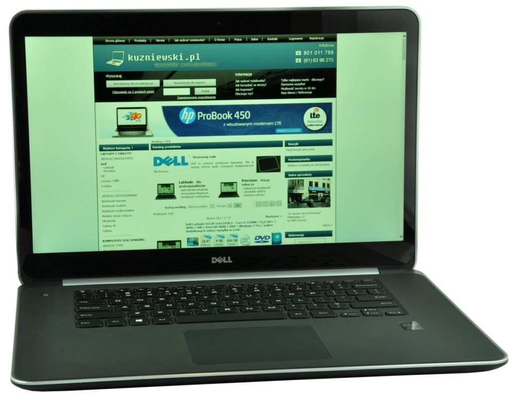 Dell laptop open to a Polish tech retailer homepage (kuzniewski.pl) displayed on the screen with product banners and navigation links.