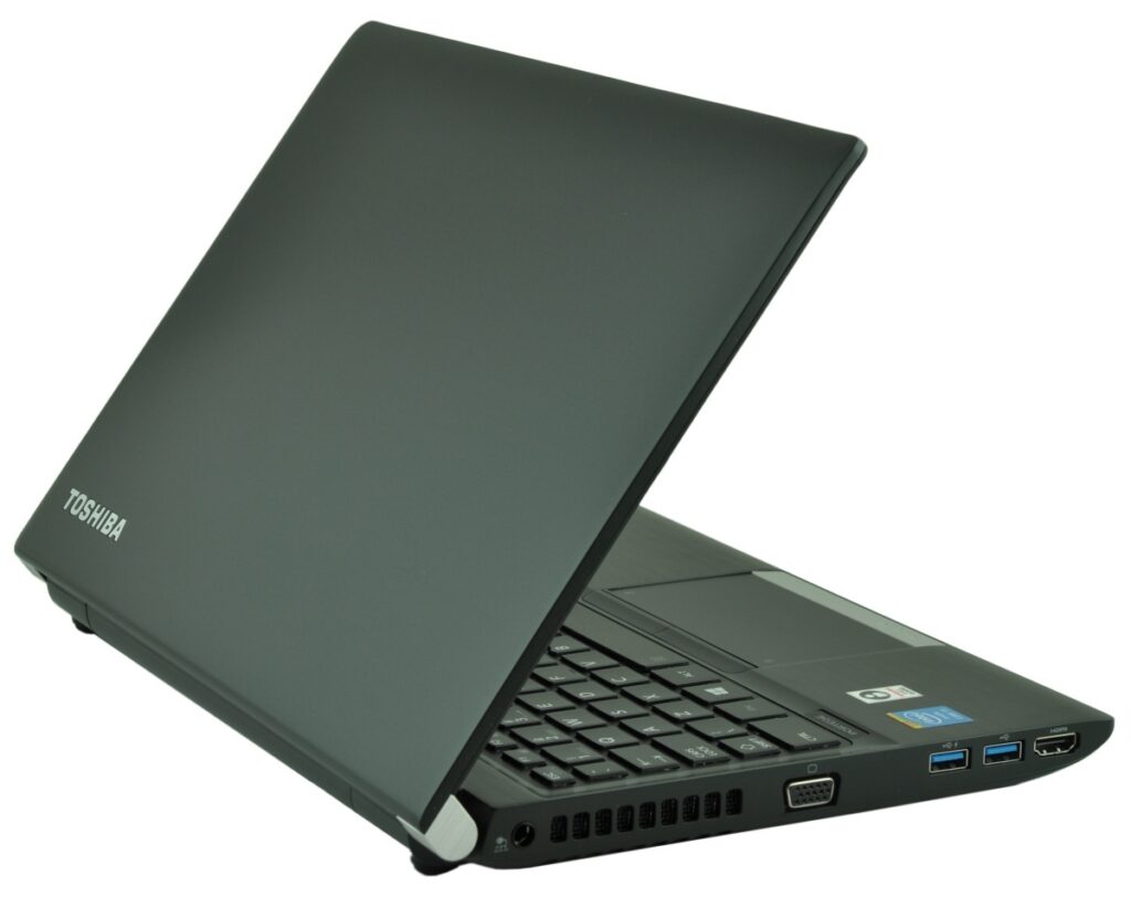 Toshiba laptop partially open, showing keyboard and side ports on a dark gray chassis