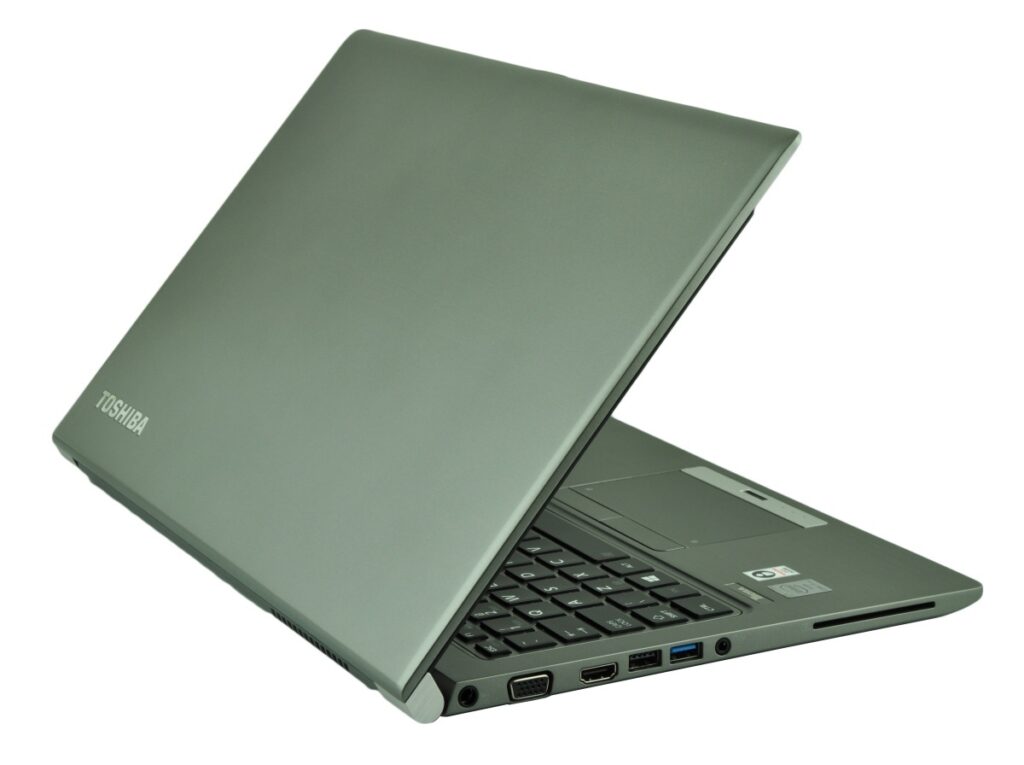 Green Toshiba laptop opened at an angle, showing the keyboard and side ports (HDMI, USB, VGA, and card reader)