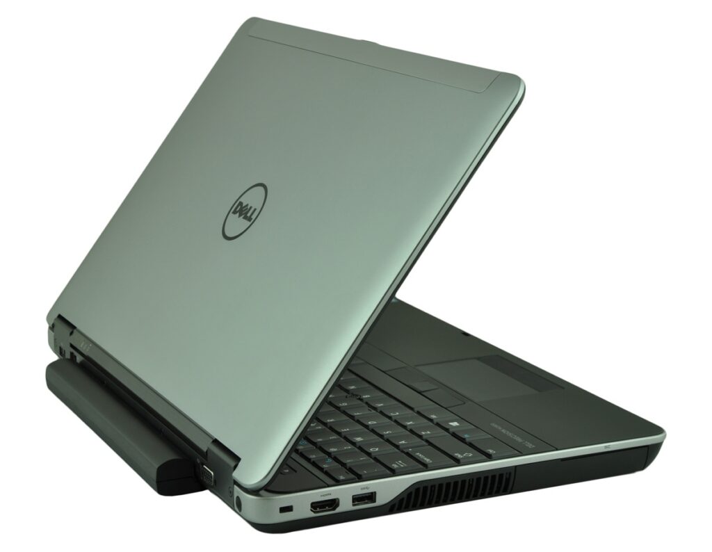 Silver Dell laptop opened and angled to show keyboard and side ports on a white background, partially raised screen base.