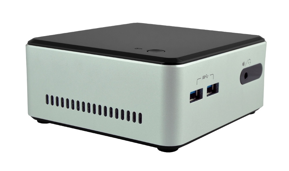 Compact mini PC with black top and beige body; side USB ports, power jack, and vented side panel.