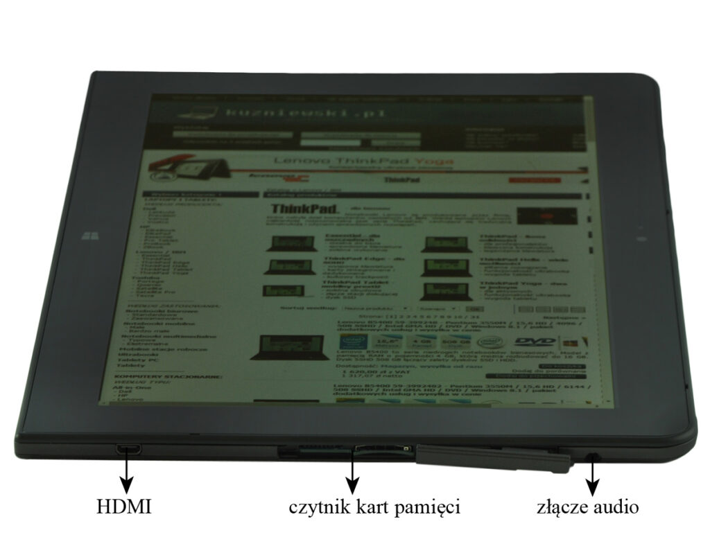 Tablet with a web page on screen; bottom edge shows labeled ports: HDMI, memory card reader, and audio jack.