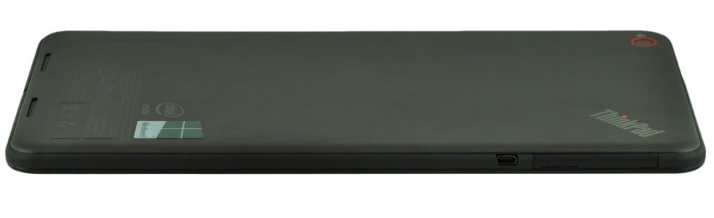 Side view of a black tablet with ThinkPad branding on the back, lying flat and slightly rotated.
