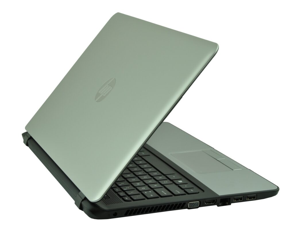 hp-350-g1-f7y53ea-core-i_127419 - lab-kuzniewski.pl - Testy laptopów, recenzje i porównania Open silver laptop viewed from the side, showing keyboard and right-side ports (USB, HDMI, VGA). It’s angled with the lid raised.