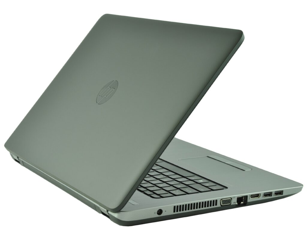 Open silver HP laptop angled to show keyboard and side ports, with logo on the lid.