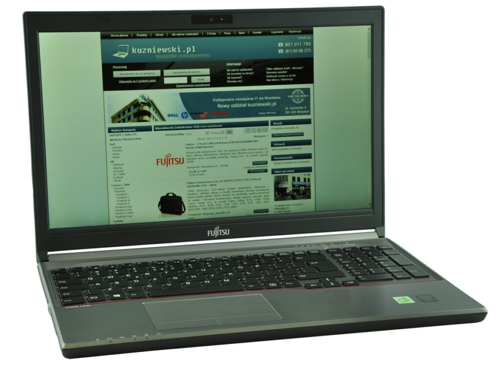 Fujitsu laptop open, displaying a Polish tech retailer website on the screen