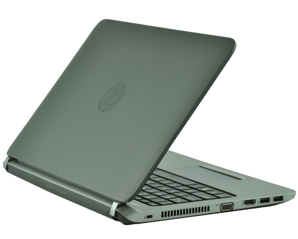 hp-probook-430-g2-g6w25e_129669 - lab-kuzniewski.pl - Testy laptopów, recenzje i porównania Open HP laptop shown from side angle, highlighting keyboard and ports (VGA, HDMI, USB) on the right edge.