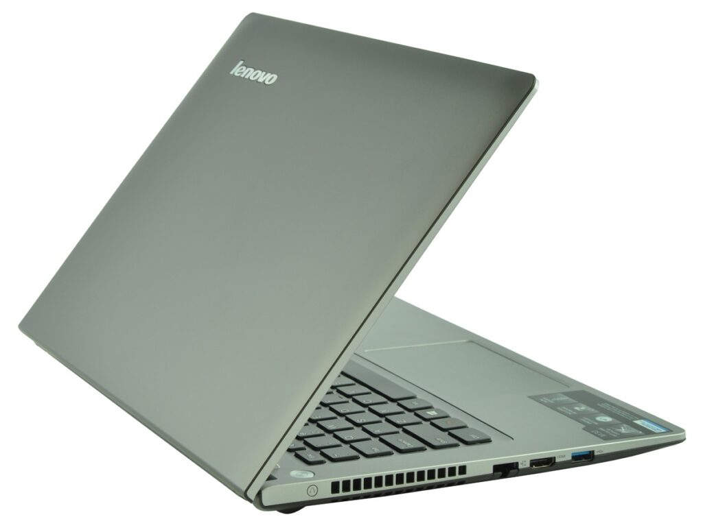 lenovo-m30-70-59-428988_130066 - lab-kuzniewski.pl - Testy laptopów, recenzje i porównania Lenovo laptop opened with keyboard visible, silver chassis, angled side view showing ports on the right side