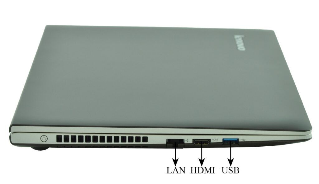 lenovo-m30-70-59-428988_130075 - lab-kuzniewski.pl - Testy laptopów, recenzje i porównania Side view of a closed silver Lenovo laptop with LAN, HDMI, and USB ports visible.