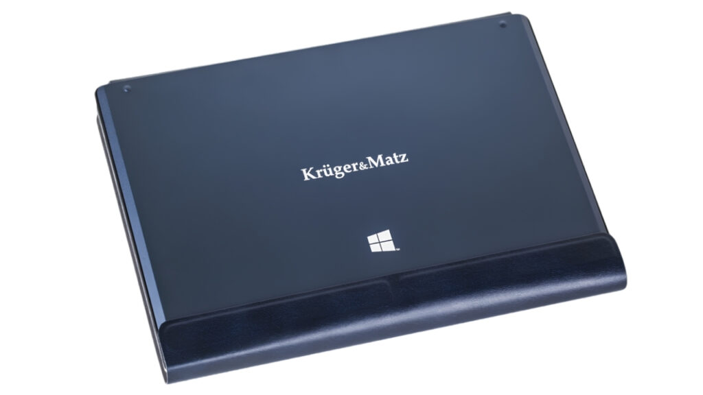 Blue Krüger & Matz laptop/tablet closed on a dark leather stand with Windows logo visible on the back