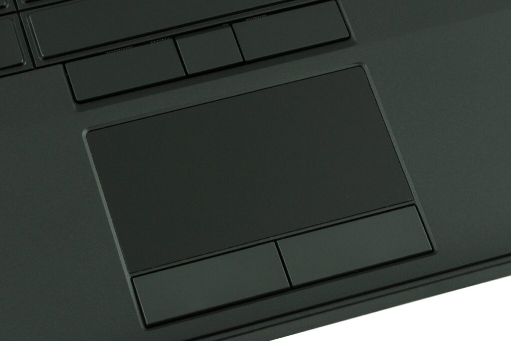 Close-up of a dark laptop touchpad with rectangular left and right click buttons above and below it.