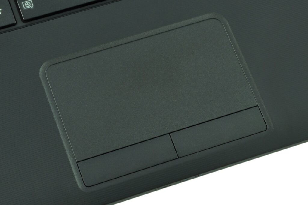 Close-up of a laptop touchpad with two separate click buttons visible.