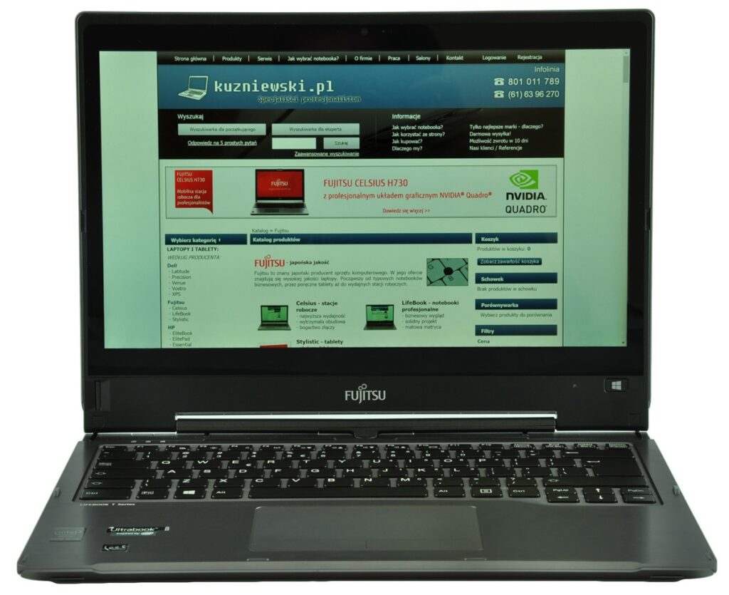 fujitsu-lifebook-t904-lk_130537 - lab-kuzniewski.pl - Testy laptopów, recenzje i porównania Fujitsu laptop open with a Polish-language website displayed on the screen, showing a blue and green homepage layout.