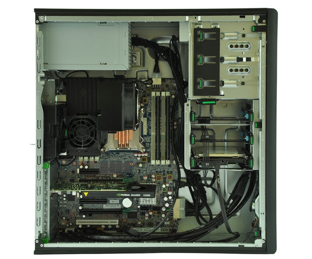 Internal view of a desktop PC with motherboard, GPU (NVIDIA Quadro K2000), RAM, and power supply visible in an opened case