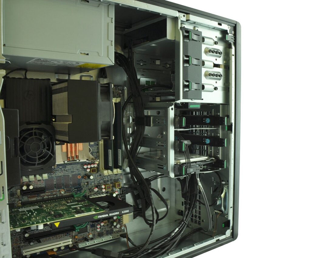 Open computer case with motherboard, PCIe cards, cooling fan, and an Nvidia Quadro K2000 GPU visible inside the tower.