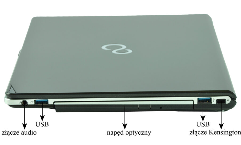 Closed laptop viewed from the side, showing audio jack, USB port, optical drive, and Kensington lock on the sides.