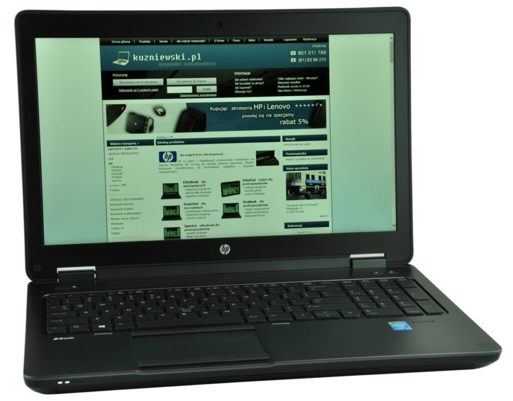 laptop-hp-zbook15-g2-3 - lab-kuzniewski.pl - Testy laptopów, recenzje i porównania HP laptop showing a Polish electronics retailer homepage with product categories and a blue-green header on the screen
