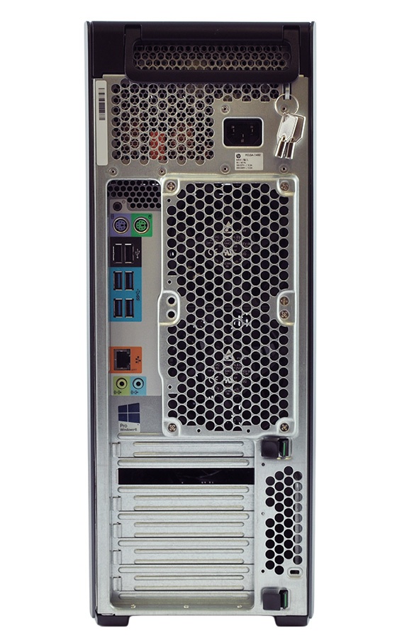 Rear view of a desktop computer tower: large fan grille, exposed power supply, multiple expansion slots, USB ports, audio/PS2 ports, and a metal chassis with ventilation holes.