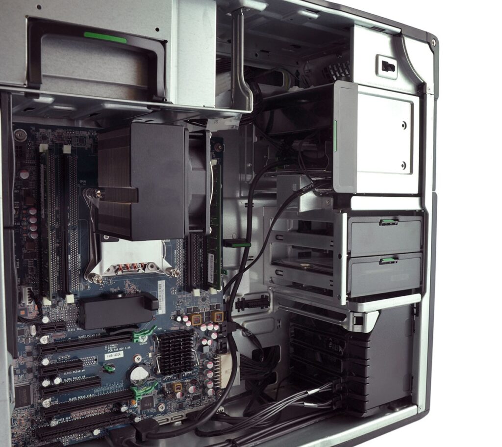 Inside a desktop computer with the motherboard, CPU cooler, RAM slots, and drive bays visible through an open case.