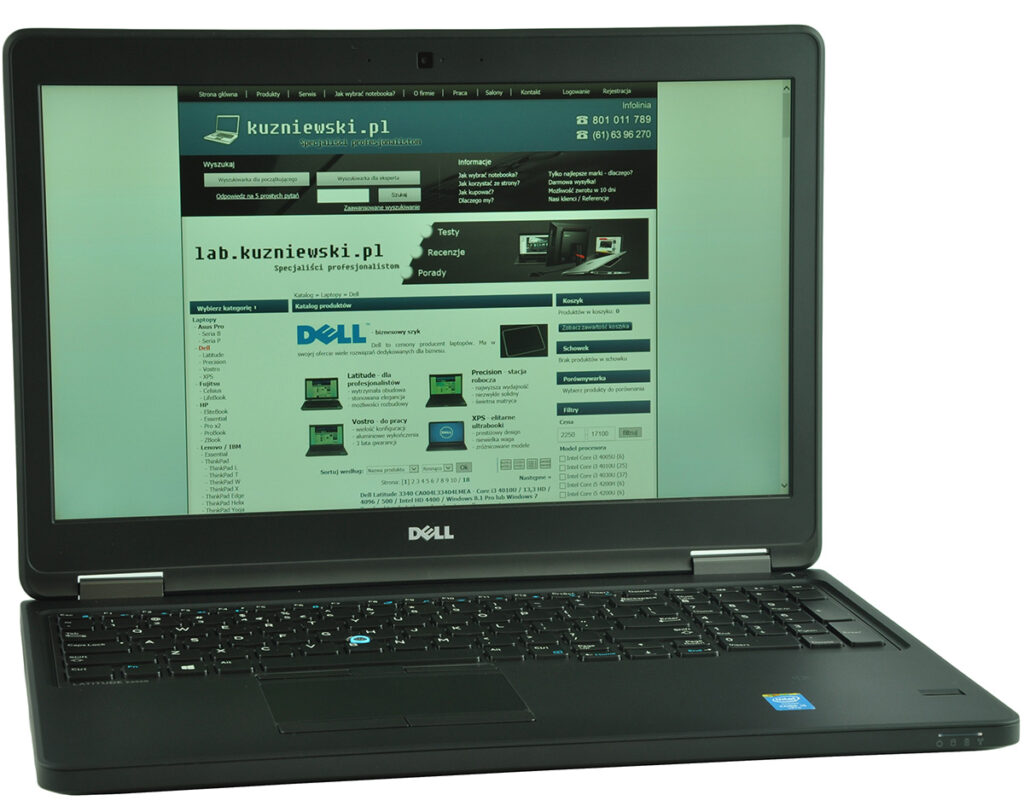 Dell laptop displaying the kuzniewski.pl tech website on screen, with product categories visible