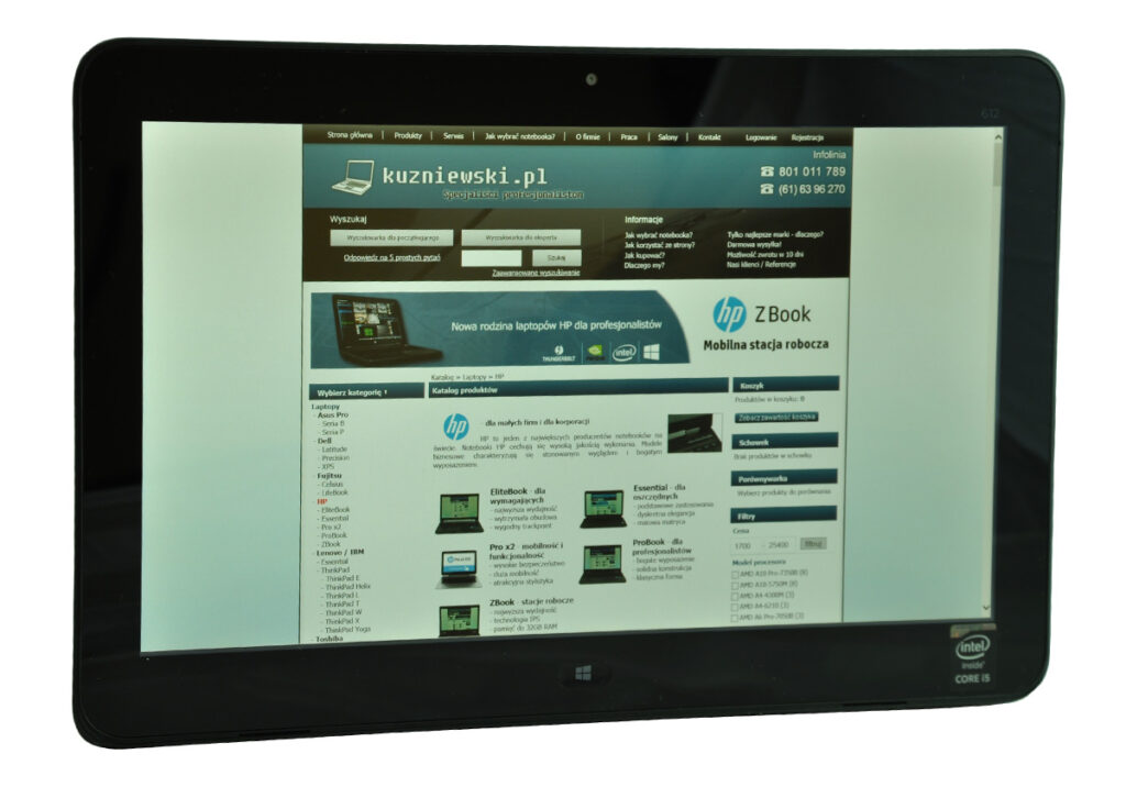 laptop-hp-probook-x2-612-10 - lab-kuzniewski.pl - Testy laptopów, recenzje i porównania Tablet device showing a Polish laptop retailer webpage with a blue header and HP banner on screen (kuzniewski.pl).