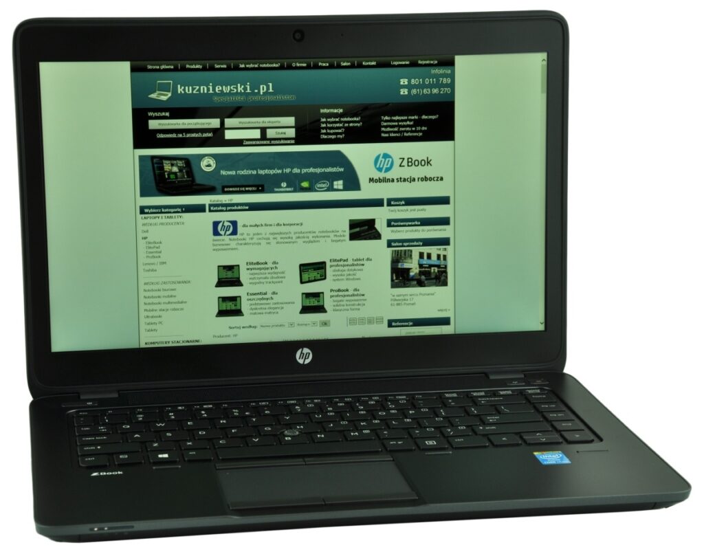 hp-zbook-14-g2-j8z75ea-c_130727 - lab-kuzniewski.pl - Testy laptopów, recenzje i porównania HP laptop with the screen showing a Polish tech website (kuzniowski.pl) and a product grid