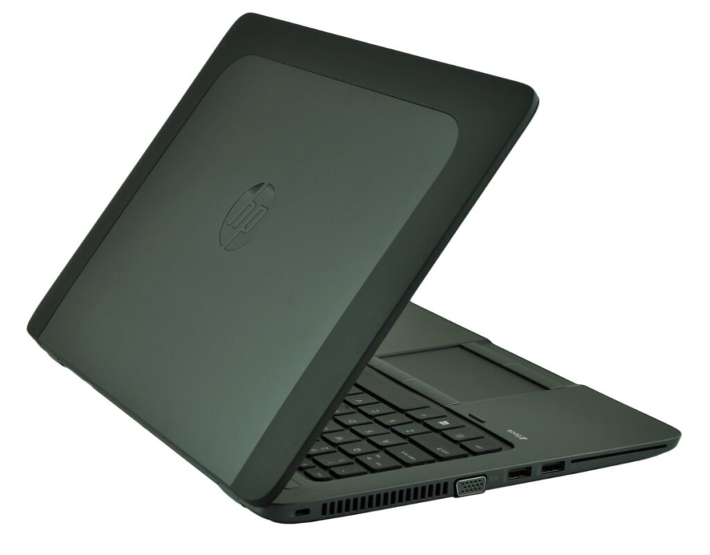 hp-zbook-14-g2-j8z75ea-c_130728 - lab-kuzniewski.pl - Testy laptopów, recenzje i porównania Open HP laptop with dark chassis, keyboard visible and rear hinge, angled to show ports along the side (VGA, USB)