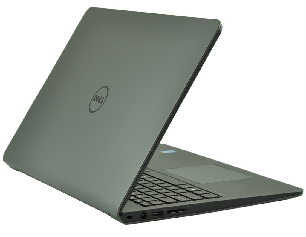 Dell laptop partially open, angled to show keyboard, touchpad, and side ports on a grey lid