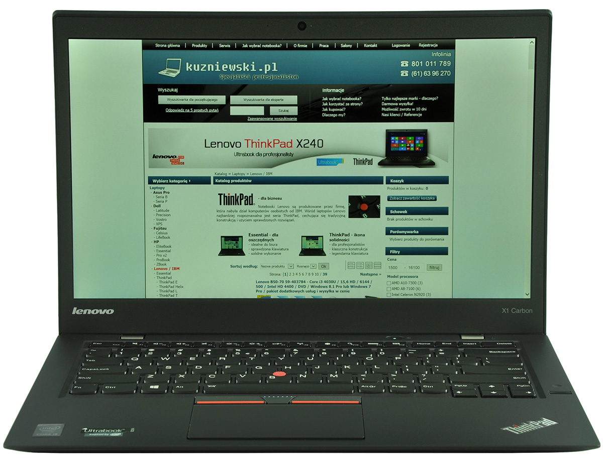 laptop-lenovo-thinkpad-x1-carbon3-1 - lab-kuzniewski.pl - Testy laptopów, recenzje i porównania Open black Lenovo ThinkPad laptop displaying a Polish tech website on screen; ThinkPad X1 Carbon badge visible on palm rest.