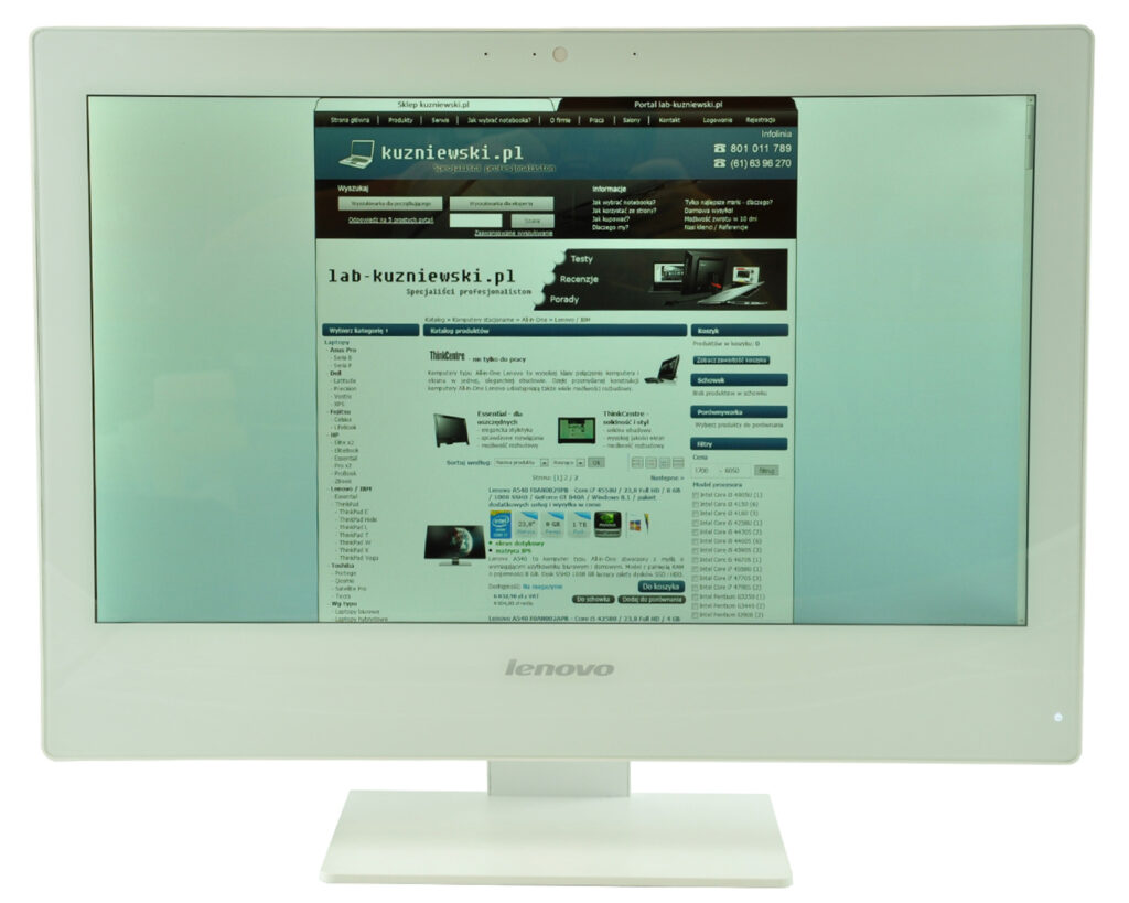 Lenovo monitor displaying a Polish website homepage with blue header and navigation menus.