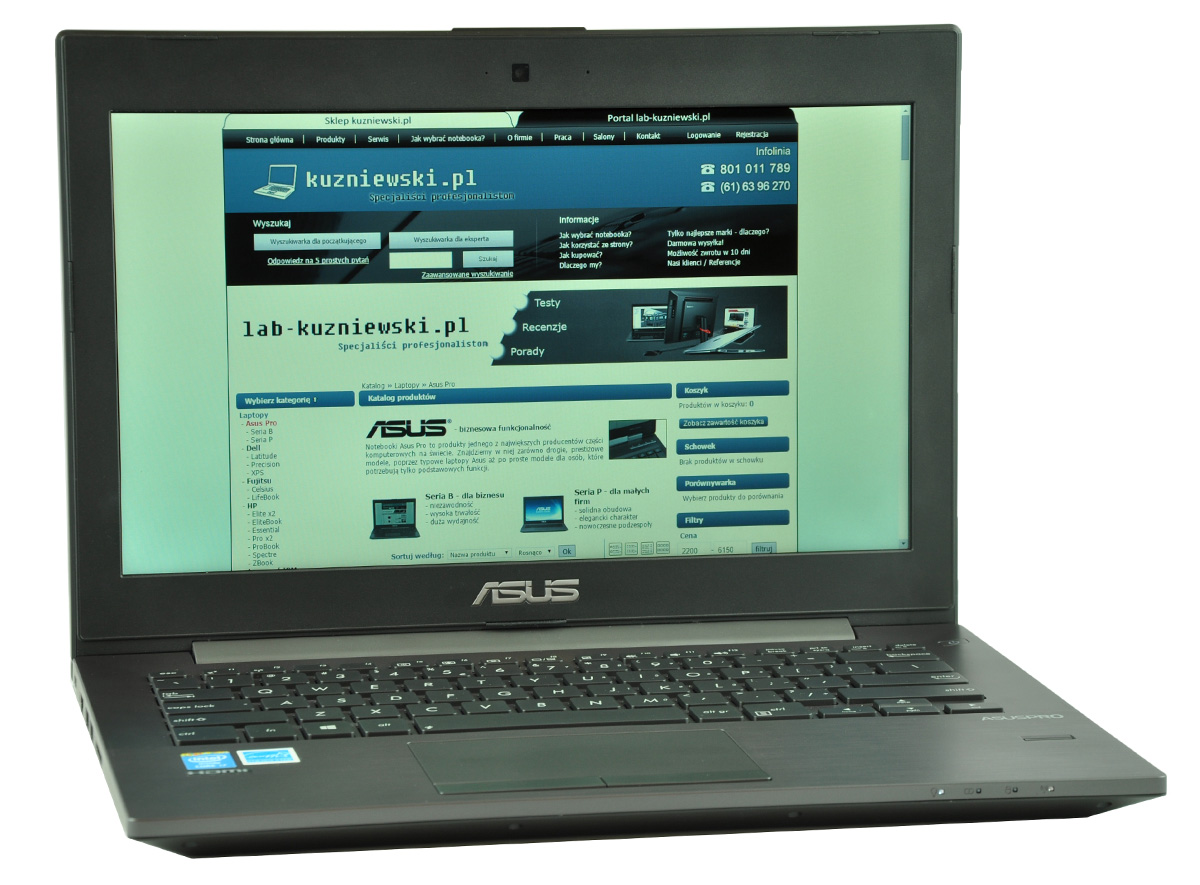 ASUS laptop showing a blue Polish tech site on the screen (lab-kuzniewski.pl)