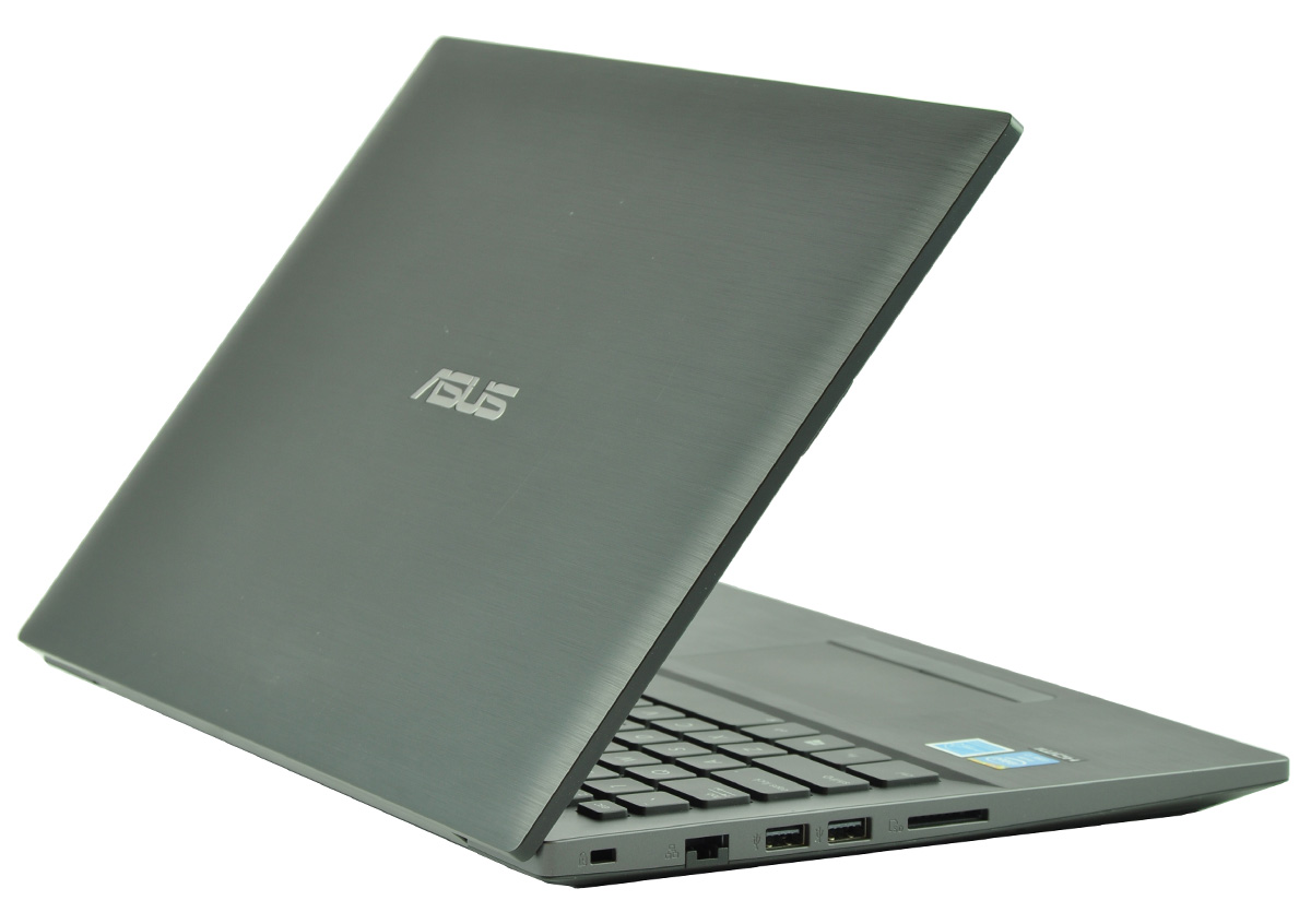 Grey Asus laptop open at an angle, showing side ports and keyboard, on a white background.