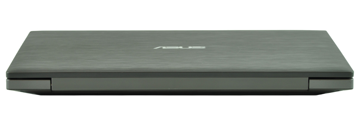Closed dark gray ASUS laptop, viewed from the side showing a thin, brushed metal lid with the ASUS logo mainly centered on top surface.