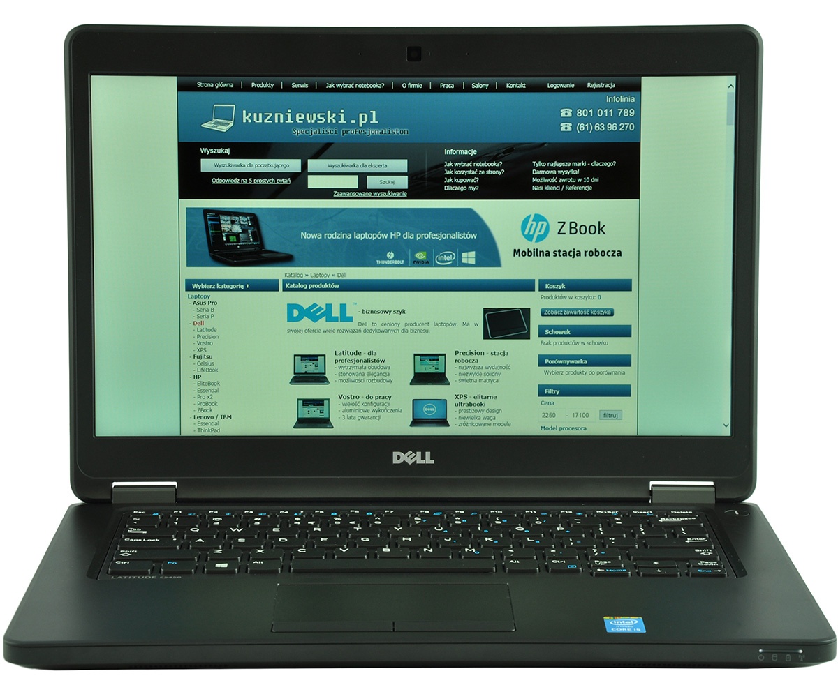 Dell laptop open with a Polish retailer webpage displayed on screen, blue header and product catalog visible on the homepage, keyboard and touchpad in view.