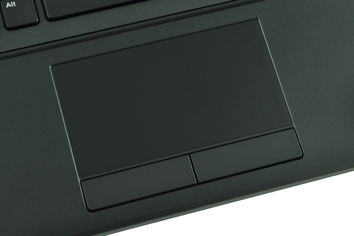 Close-up of a dark laptop touchpad with two rectangular buttons beneath it.