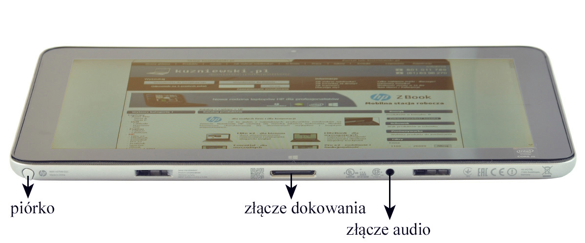 Tablet laid flat showing left-side stylus slot, center docking connector, and right audio jack (Polish labels: piórko, złącze dokowania, złącze audio).