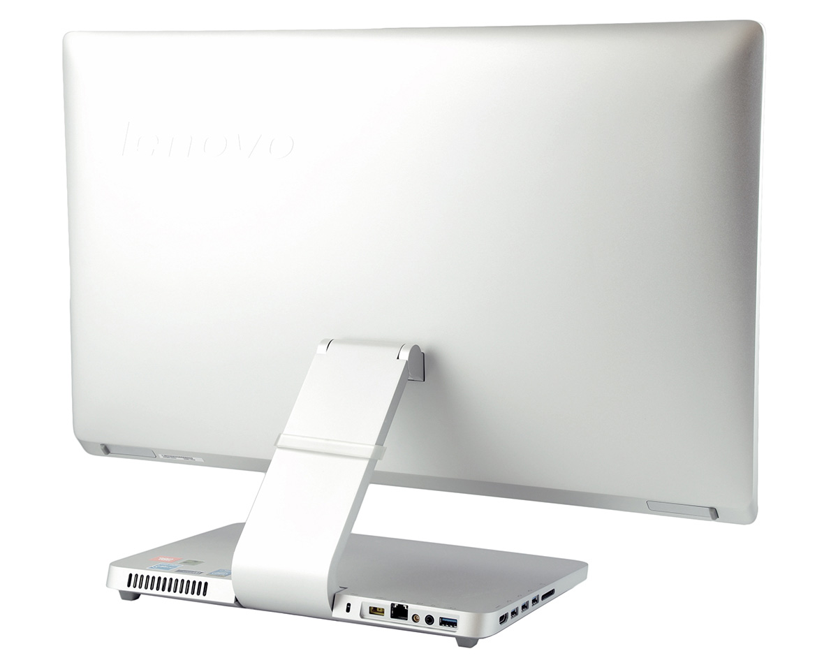 lenovo-a540-f0an0029pb-c_132538 - lab-kuzniewski.pl - Testy laptopów, recenzje i porównania Back view of a white Lenovo all-in-one desktop on a stand, with visible rear ports and ventilation on the base.