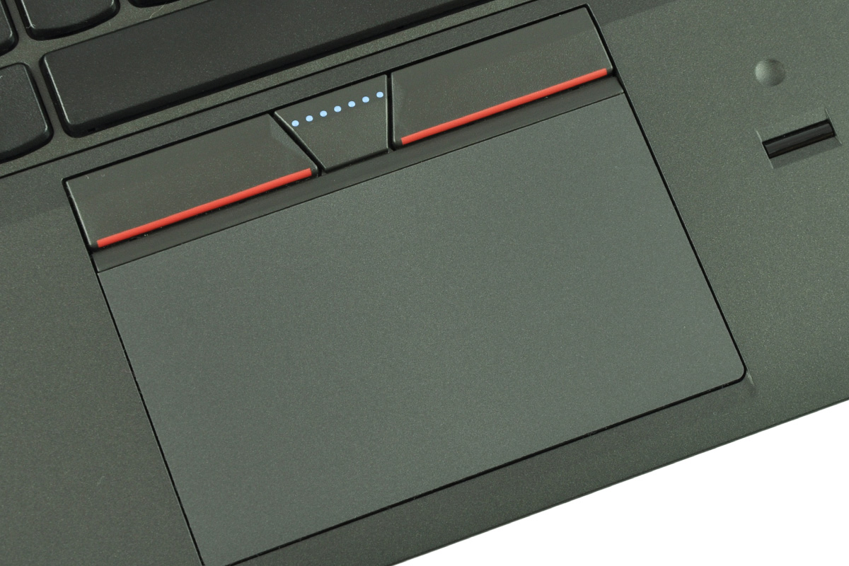 laptop-lenovo-thinkpad-e450-6 - lab-kuzniewski.pl - Testy laptopów, recenzje i porównania Close-up of a laptop touchpad with red-edged left/right buttons above it and a small central triangular button with blue indicator dots above the pad.
