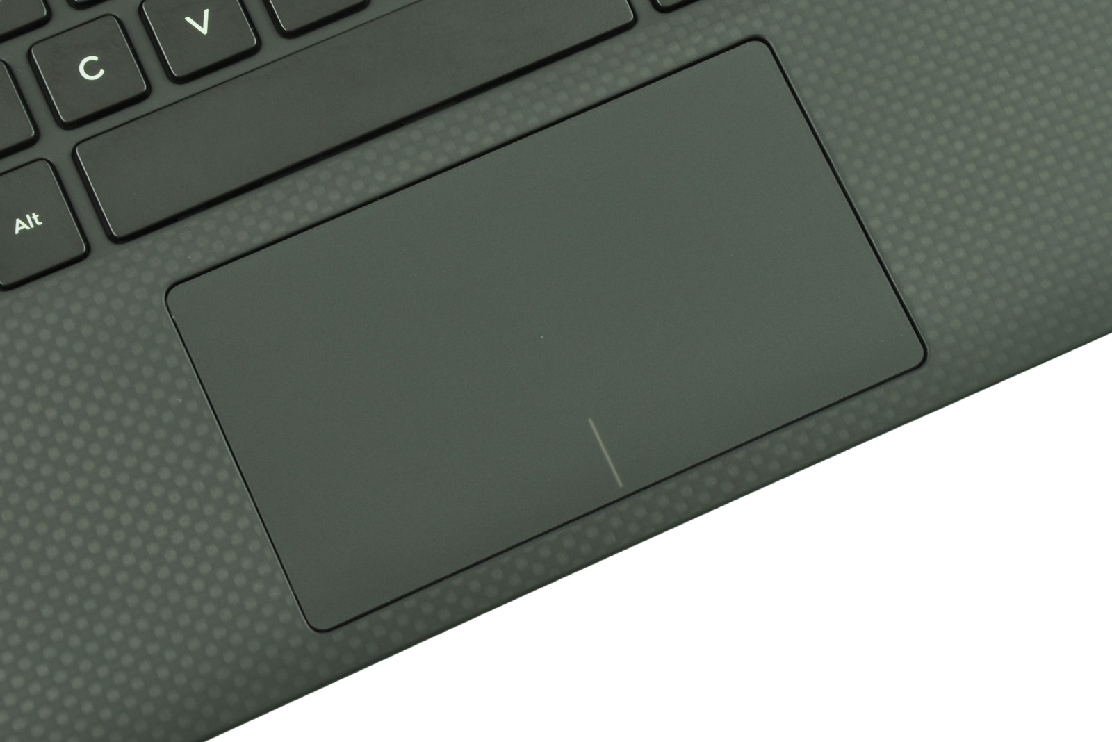 Close-up of a dark laptop showing the keyboard edge and a large touchpad, with the Alt key visible nearby.