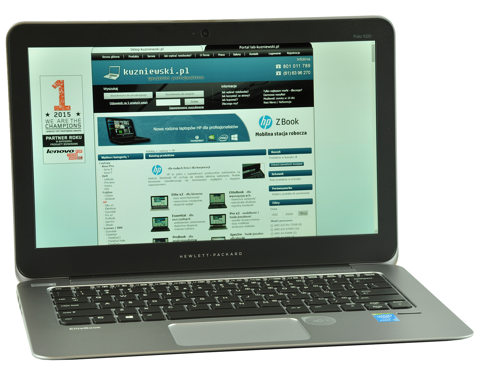 HP EliteBook laptop displaying a tech website (kuzniewski.pl) on its screen, showing a blue header and product grid.