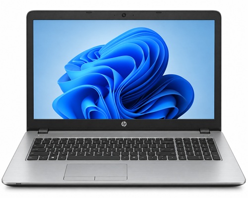 probook_470_2019_poradnik_lab - lab-kuzniewski.pl - Testy laptopów, recenzje i porównania Open silver laptop with a blue abstract wallpaper on the screen and a dark keyboard.