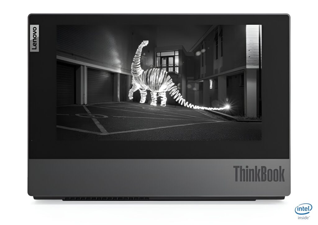 Lenovo ThinkBook laptop showing a grayscale image of a neon dinosaur sculpture in a dark alley.