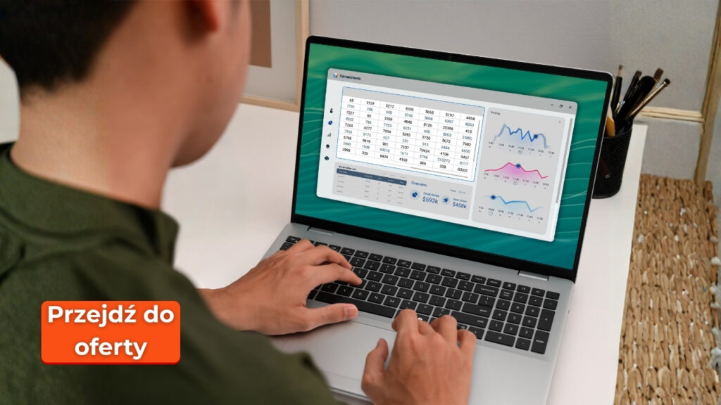 Person typing on a laptop displaying a data dashboard; orange badge reads 'Przejdź do oferty'.