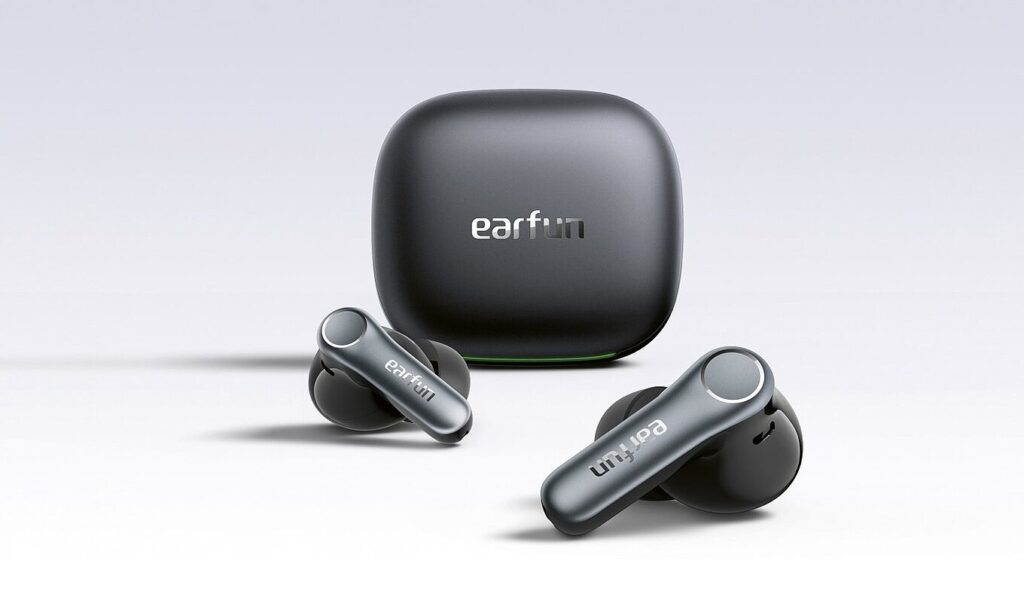 Wireless EarFun earbuds with a matching charging case on a light surface, logo visible on case and buds.