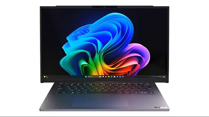 Lenovo ThinkBook Project Swan_01 - lab-kuzniewski.pl - Testy laptopów, recenzje i porównania Open ThinkBook-style laptop displaying a vibrant multicolor abstract wallpaper with a backlit keyboard and slim gray chassis.