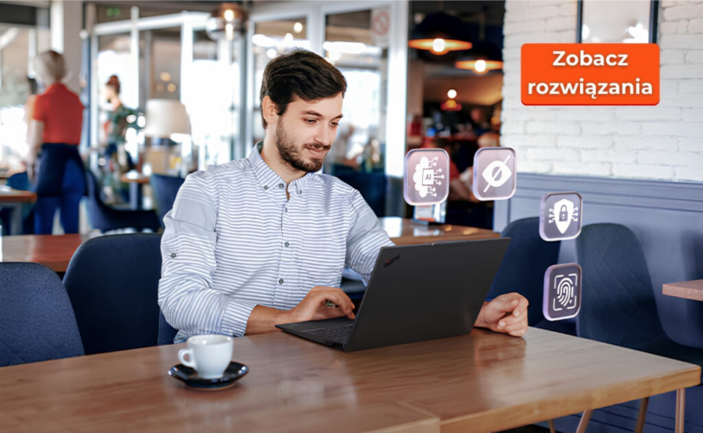 Lenovo_ThinkPad_E16_Gen4_1709_news_006 - lab-kuzniewski.pl - Testy laptopów, recenzje i porównania Man in a striped shirt sits at a cafe table using a laptop; floating icons and an orange 'Zobacz rozwiązania' badge appear nearby, suggesting a tech solution demo.